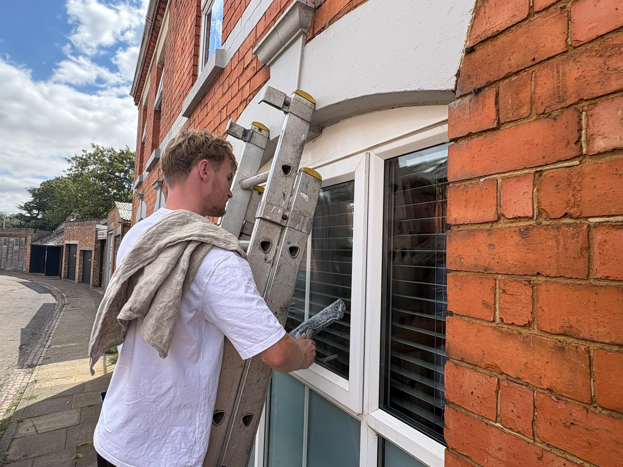 Bay window squeegeed from a ladder
