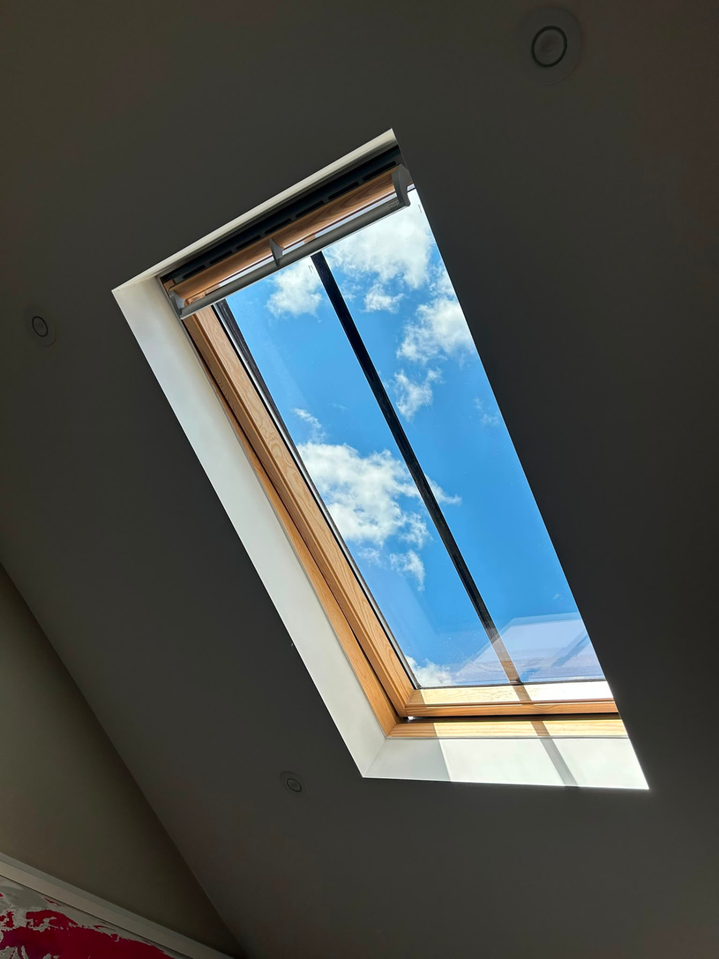 Cleaned skylight looking out to blue sky